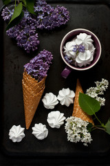 Still life with lilac and ice cream cone