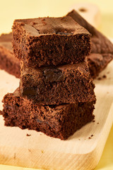 Homemade chocolate brownies with coffee, close up