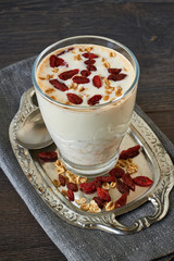 Homemade smoothie made from oats milk and goji beries