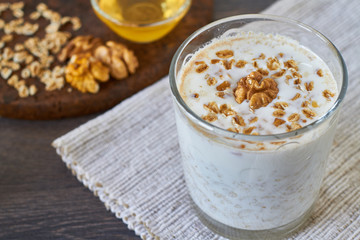 Homemade smoothie made from oats milk, nuts and honey