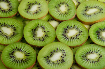 Background of green slices kiwi 