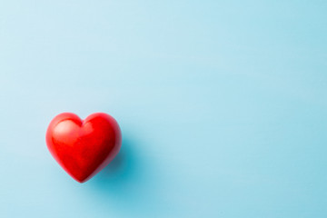 Red heart on blue background.