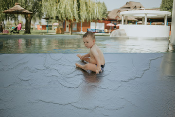 one boy while playing in the pool