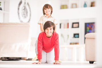 Brothers at home playing together