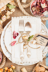 Tableware and silverware with dry flowers