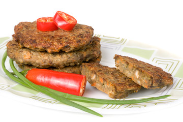 liver pancakes or cutlets with chili pepper and green onions isolated on white background