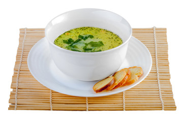 hot tasty soup in white plate with crackers