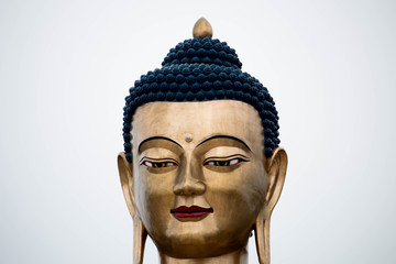 Bhutan giant golden bhudda statue face with a diamond