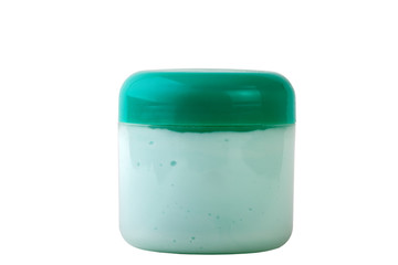 green jar of cream isolated on white background
