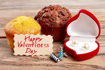 Valentine's Day card, muffin, accessory. Earrings in heart-shaped case. Presents for him and her.