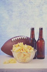 American football with beer and chips.
