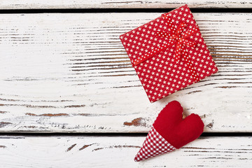 Obraz premium Fabric heart near gift box. Present wrap with star pattern. Interesting idea for greeting.