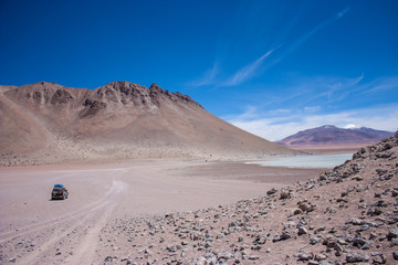 Bolivia Salar de Uyuni altiplano landscape volcano lake and desert remote offroad laguna colorada © Bjoern