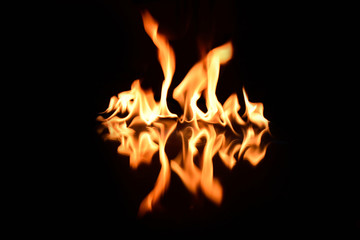   flames on a black background with mirror reflection