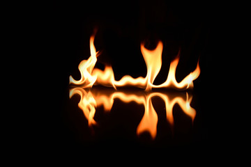   flames on a black background with mirror reflection