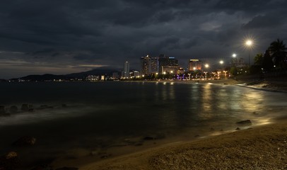 Nha Trang holiday resort skyline Vietnam slow exposure just after sunset with the city lights ablaze.