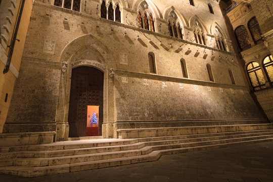 Siena, January 2016: Main Gate of Monte dei Paschi Bank in Piazz