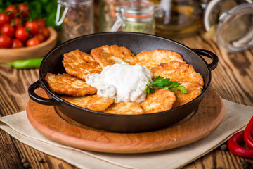 Fried savory pancakes with potato, onion and garlic