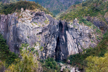 Ile de la Reunion la chapelle rock canyon gorge with river colorful rock formation landscape...