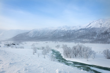Fototapeta na wymiar Norway winter landscape snow river and mountains