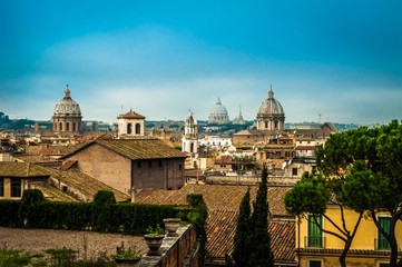 Fototapeta na wymiar Rooftops of Rome with many cupolae.