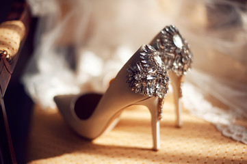 wedding concept. bride's shoes and veil