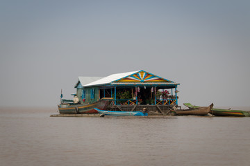 Cambodia Tonle Sap Lake swimming villages brown water poor people