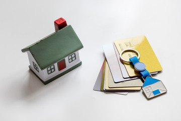 credit cards concept mortgag for new home on white background