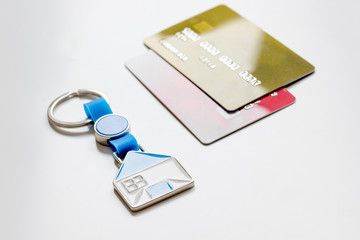 credit cards, key ring - concept mortgage on white background