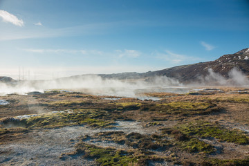 Iceland geothermal field with steam hot pots with geysers 