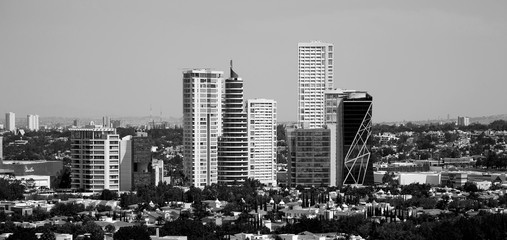 Several tall buildings black and white