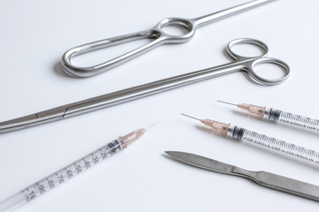 instruments for plastic surgery on white background