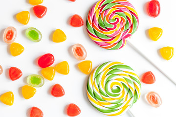 sweets and sugar candies on white background top view