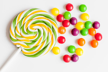 sweets and sugar candies on white background top view