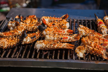 Freshly grilled giant lobsters. Street food.