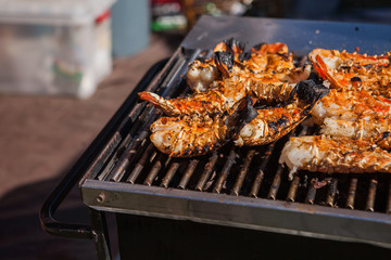 Lobsters on a grill. Lobster street food festival