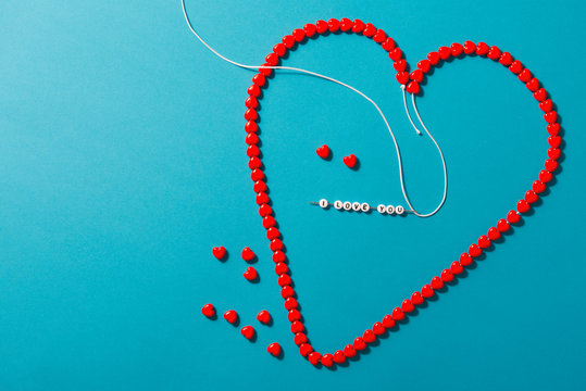 heart made from beads and the inscription i love you