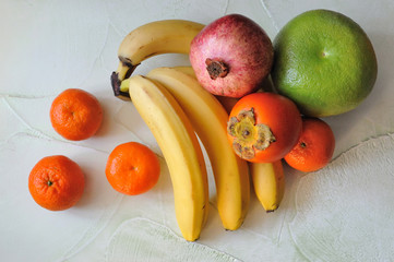 tropical fruits on textured surfaces