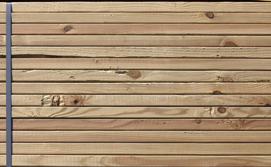 Construction lumber neatly stacked. Horizontal.