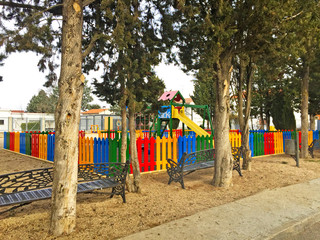 Multicolored playground with graffiti