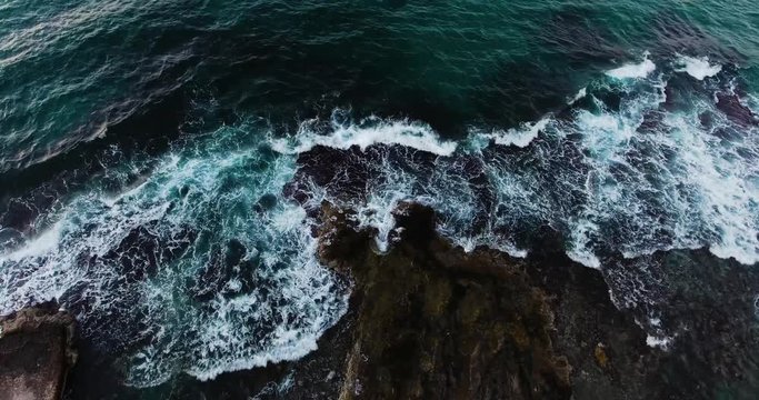 flying above beautiful wavy seashore at evenng