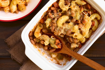Chili con carne and macaroni pasta casserole in baking dish, photographed overhead with natural light (Selective Focus, Focus on the top of the casserole)