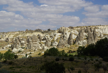 Fototapeta na wymiar The Fairy chimneys, typical geologic formations of Cappadocia.