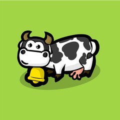 cute cow with a golden bell around on neck on a green meadow. Wh