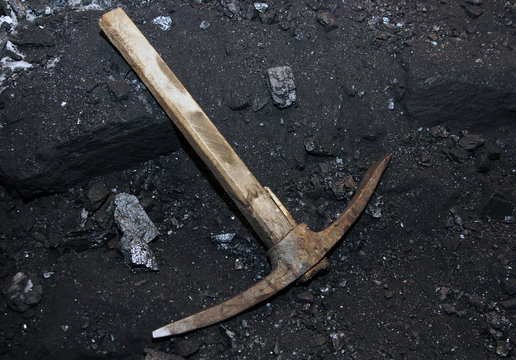 Coal mining. Pickaxe in the mine