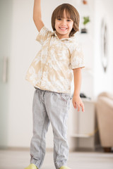 Happy children having fun and posing in new modern home