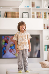Happy children having fun and posing in new modern home