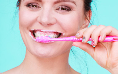 Woman brushing cleaning teeth