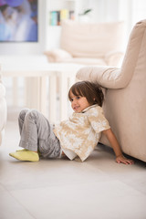 Happy children having fun and posing in new modern home