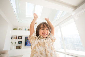 Happy children having fun and posing in new modern home